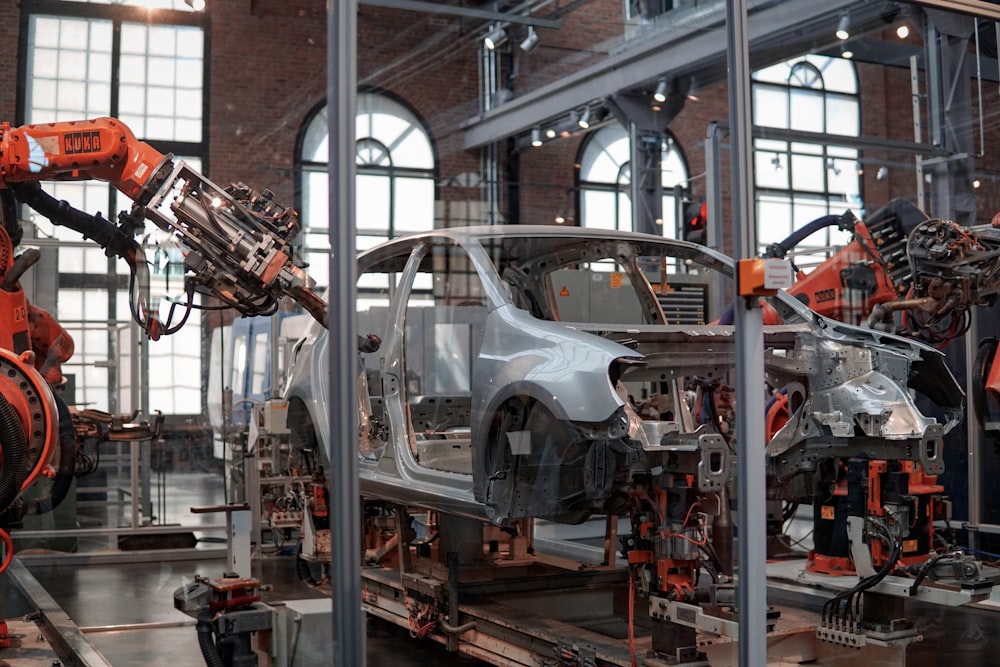 A robotic assembly line building a car body in a factory